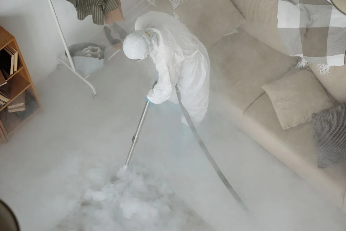 Biohazard cleanup technician in protective equipment, Buchanan, MI